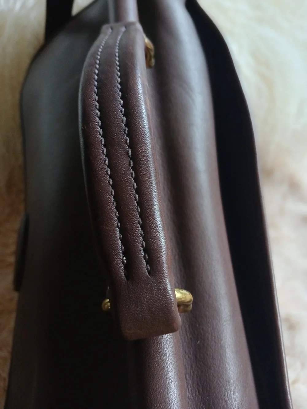 Classic Brown Leather Messenger Bag with Gold Hardware Coach.